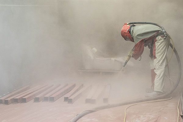 Sandblasting is the first step in the powder coating process at Smith Powder Coating